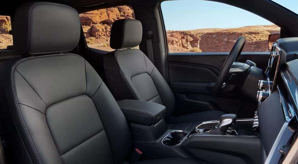 The black interior and dash are shown in a 2024 GMC Canyon Elevation.