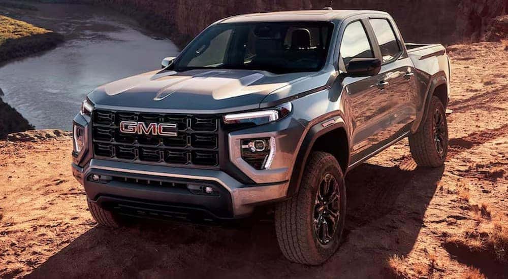 A silver 2024 GMC Canyon Elevation is shown parked after visiting a GMC dealer near Johns Creek.