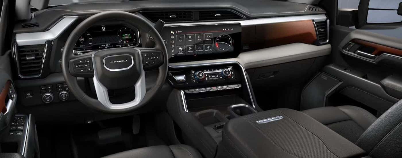 The black interior and dash are shown in a 2024 GMC Sierra 2500 Denali.