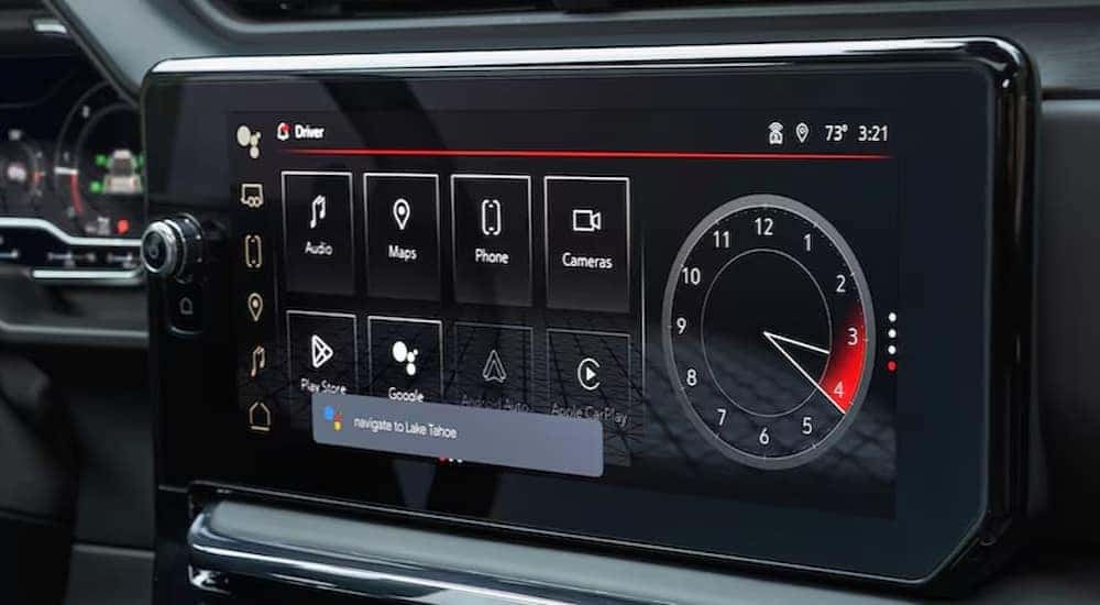 A close-up of an infotainment screen is shown in a 2025 GMC Sierra 1500.