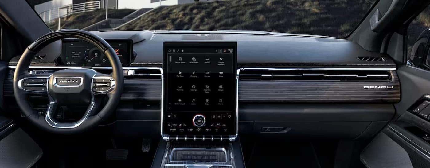 The gray interior and dash are shown in a 2025 GMC Sierra EV.