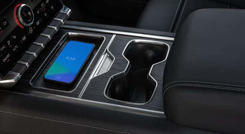Close-up of the wireless charging pad in a 2025 GMC Sierra EV Denali.