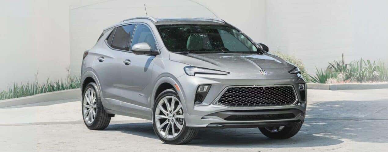 A silver 2025 Buick Encore GX Avenir is shown on concrete.
