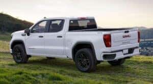 A white 2025 GMC Sierra 1500 is shown parked after visting a GMC dealer near Gainesville.