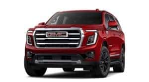 A red 2025 GMC Yukon is angled left.
