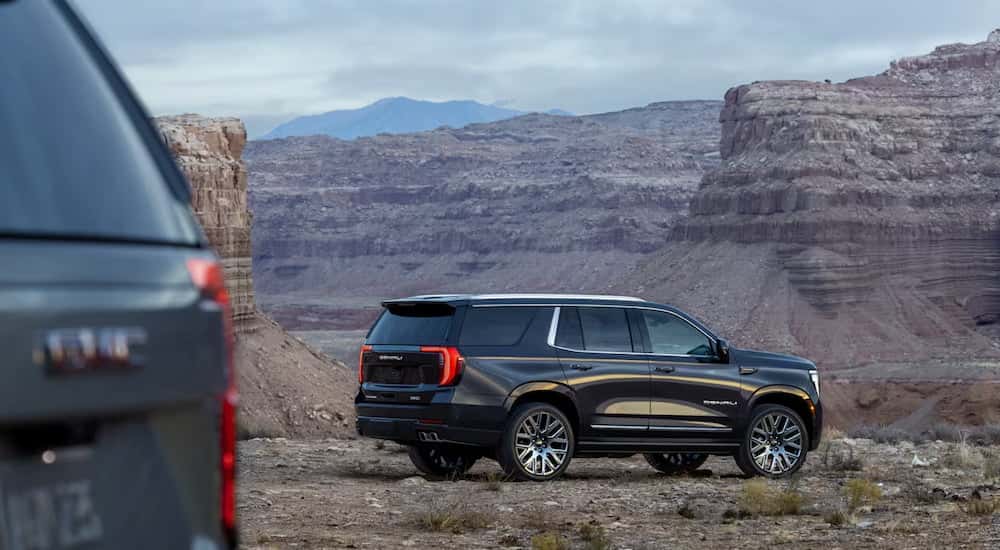Side angle view of a black 2025 GMC Yukon Denali.