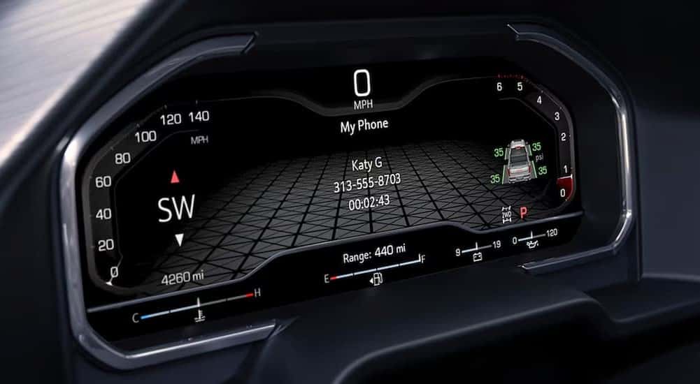 A close-up of the digital dash display is shown in a 2025 Sierra 1500 Elevation.
