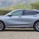 A silver 2025 Buick Envista Avenir parked on gravel.