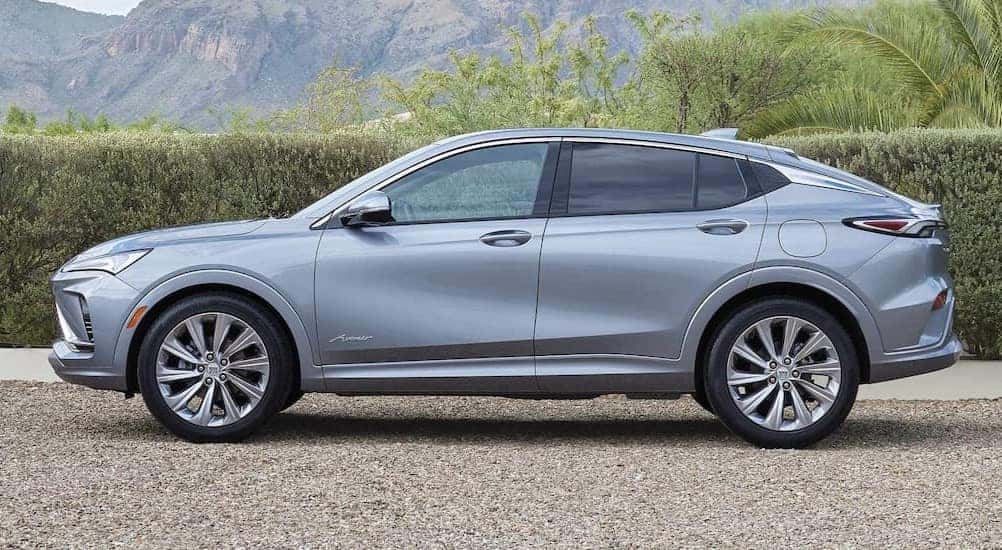 A silver 2025 Buick Envista Avenir parked on gravel.