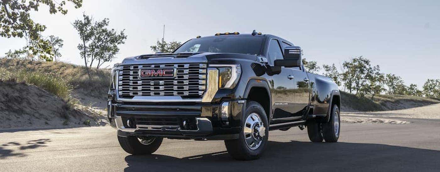 A black 2024 GMC Sierra 3500 HD Denali from the front.