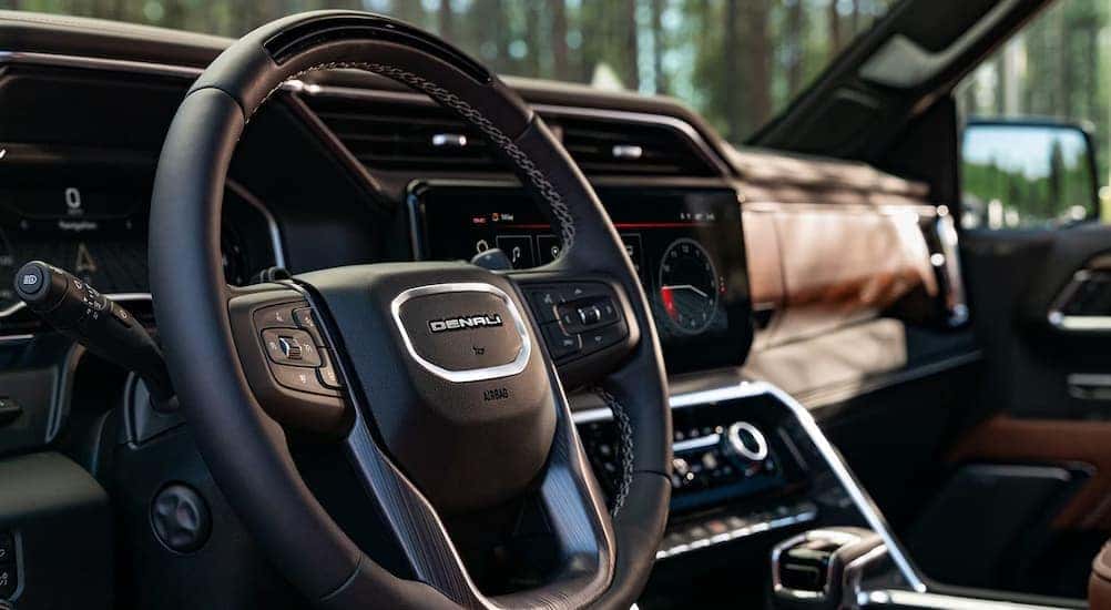 Close-up of the steering wheel in a 2025 GMC Sierra 1500 Denali.