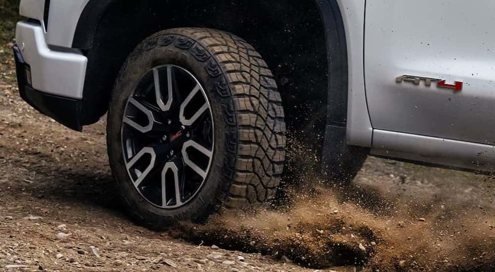 Close-up of a tire on a white 2025 GMC Sierra 1500 AT4 for sale near Duluth.