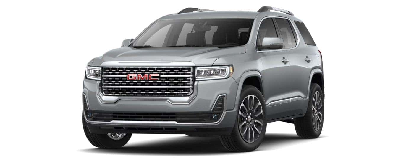 A silver 2023 GMC Acadia Denali is angled left.