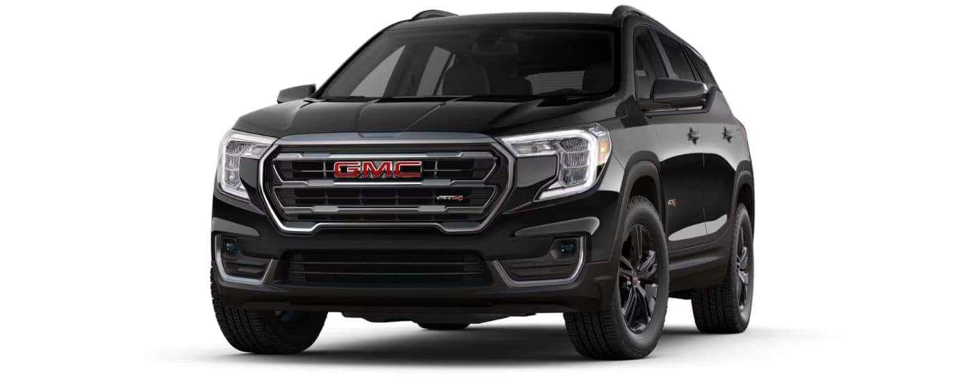 A black 2024 GMC Terrain AT4 angled left.