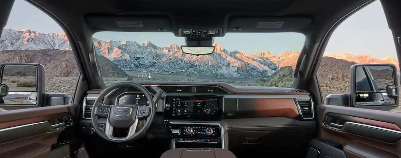 The black and brown dash in a 2025 GMC Sierra 2500 HD Denali.