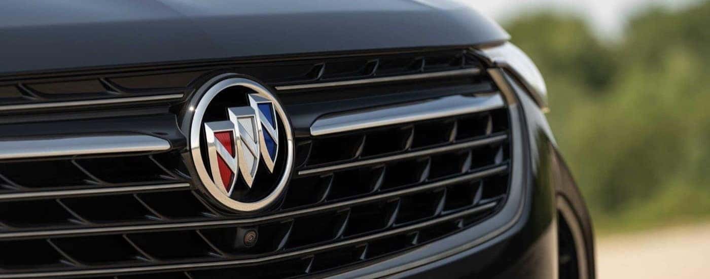 A close up shows the grille on a black 2023 Buick Envision ST.