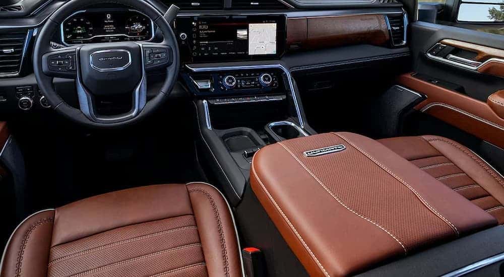 Black and brown interior and dash in a 2025 GMC Sierra HD for sale in Buford.