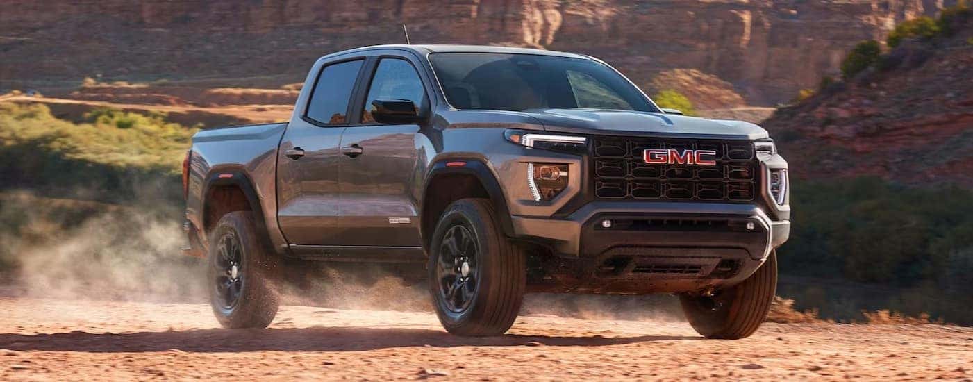 A gray 2025 GMC Canyon off-roading.