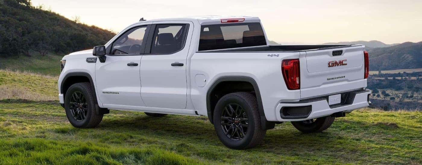 A white 2025 GMC Sierra 1500 is shown parked after visting a GMC dealer near Gainesville.
