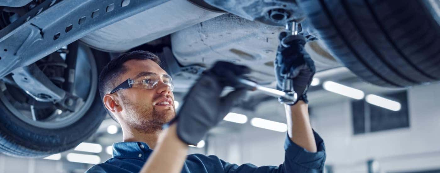 Technician performing GMC service near Duluth