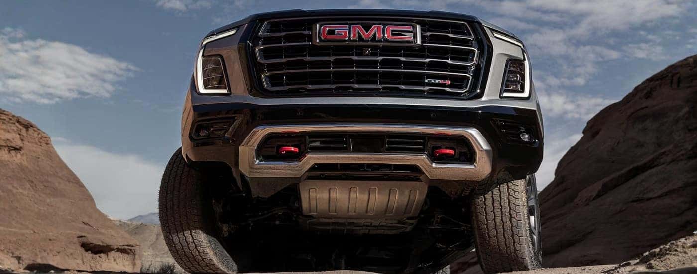 Grey 2025 GMC Yukon XL AT4 parked off-road