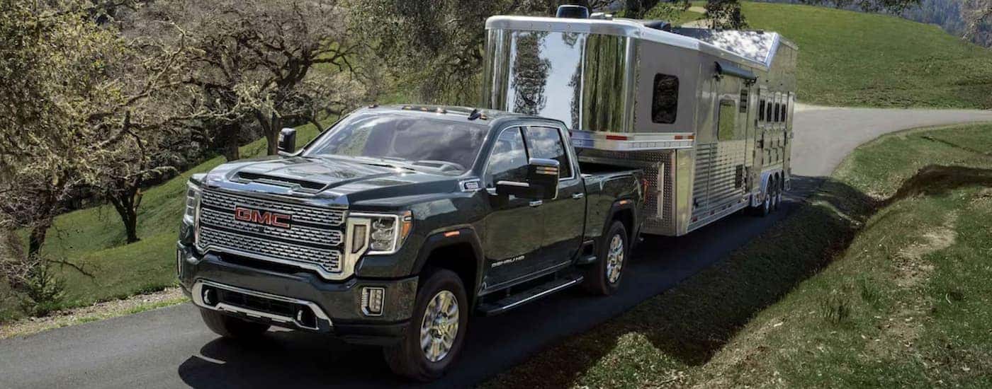 Black 2023 GMC Sierra 2500 HD for sale near Sandy Springs demonstrating towing capabilities