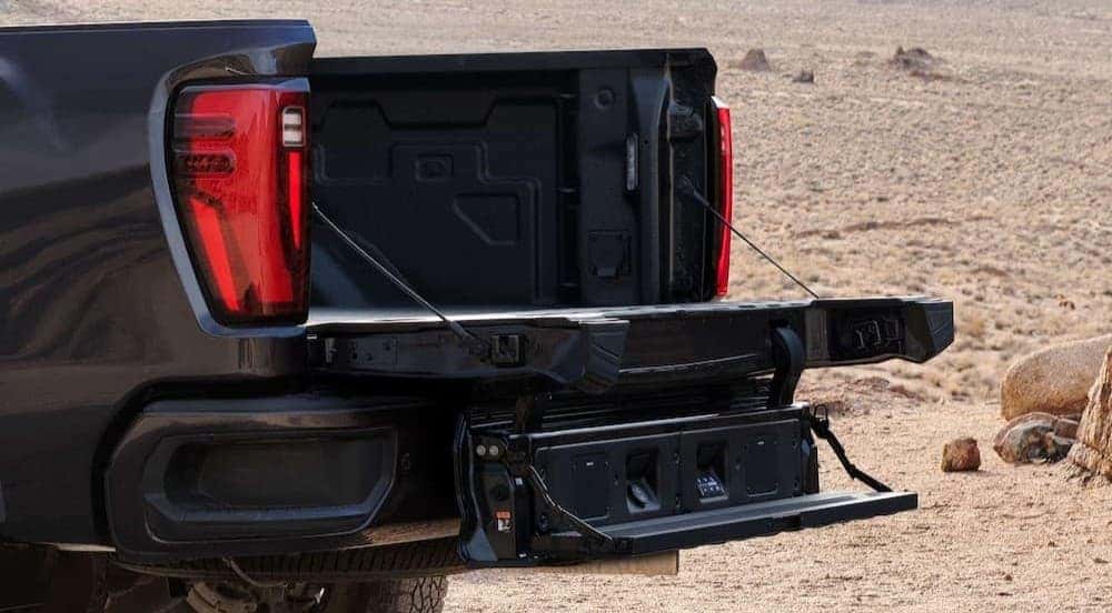 The open talgate on a black 2026 GMC Sierra 2500 HD.