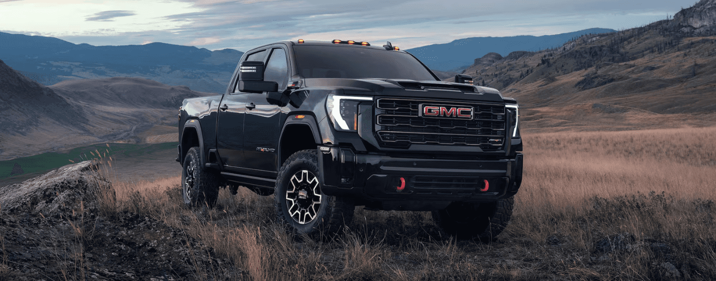 Black 2026 GMC Sierra 2500 HD AT4X parked off-road