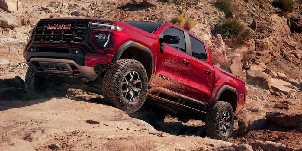 Red 2026 GMC Canyon AT4 parked on a rock