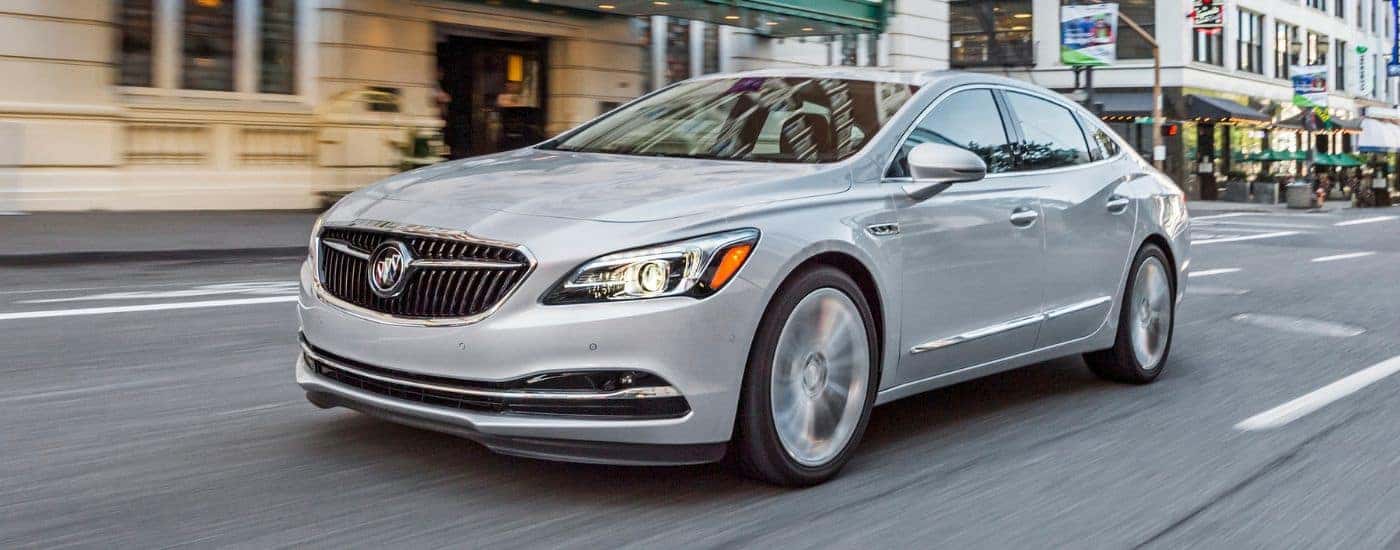 White 2019 Buick LaCrosse driving down a city street.