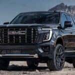 Black 2026 GMC Yukon Denali parked in a desert