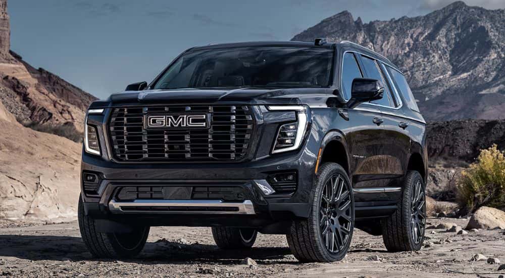 Black 2026 GMC Yukon Denali parked in a desert
