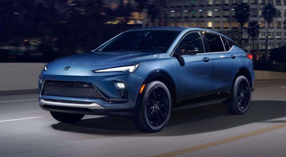 Blue 2026 Buick Envista driving down a city street