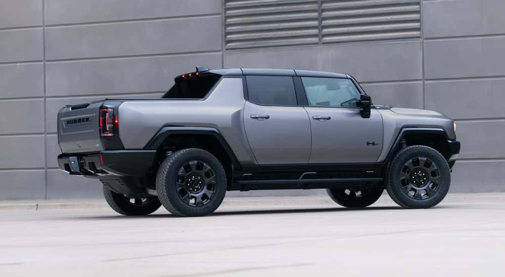 A gray 2026 GMC Hummer EV Pickup Truck shown parked on concrete.