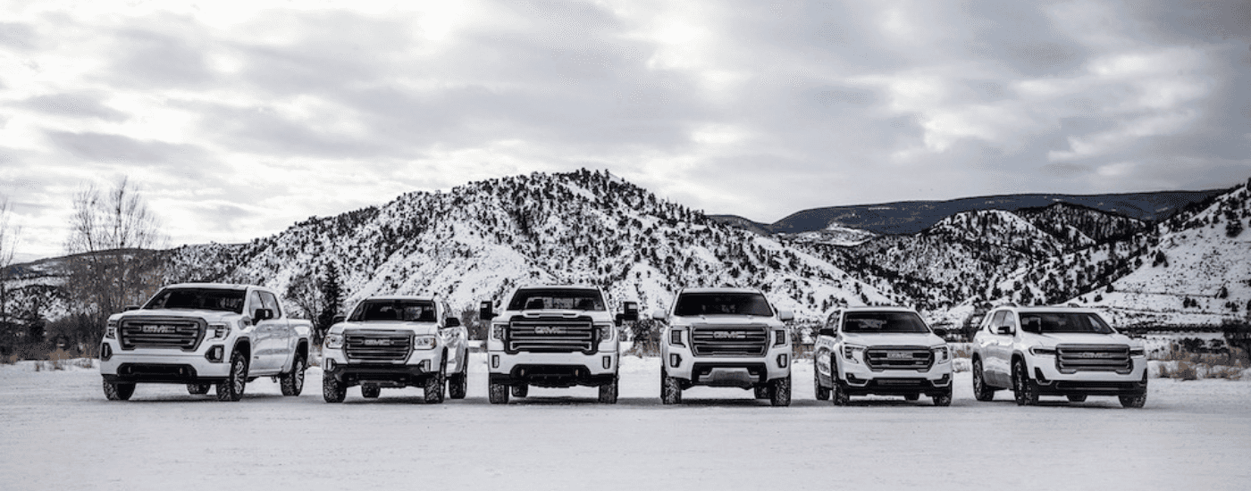 Lineup of white GMC vehicles from the 2021 model year