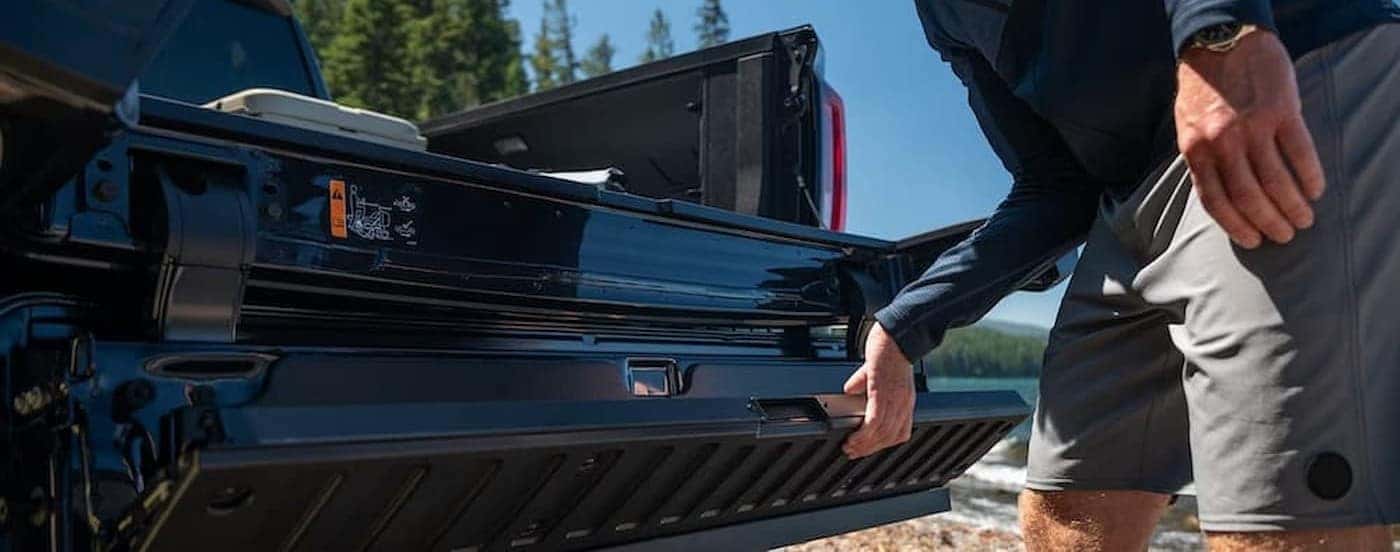 Open tailgate on a black 2026 GMC Sierra 1500.
