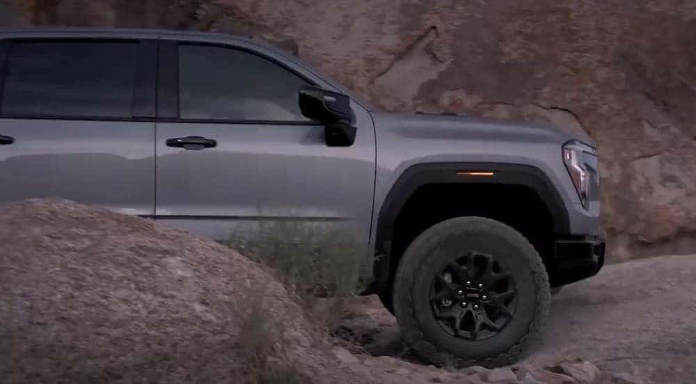 A gray 2027 GMC Sierra 1500 parked offroad.