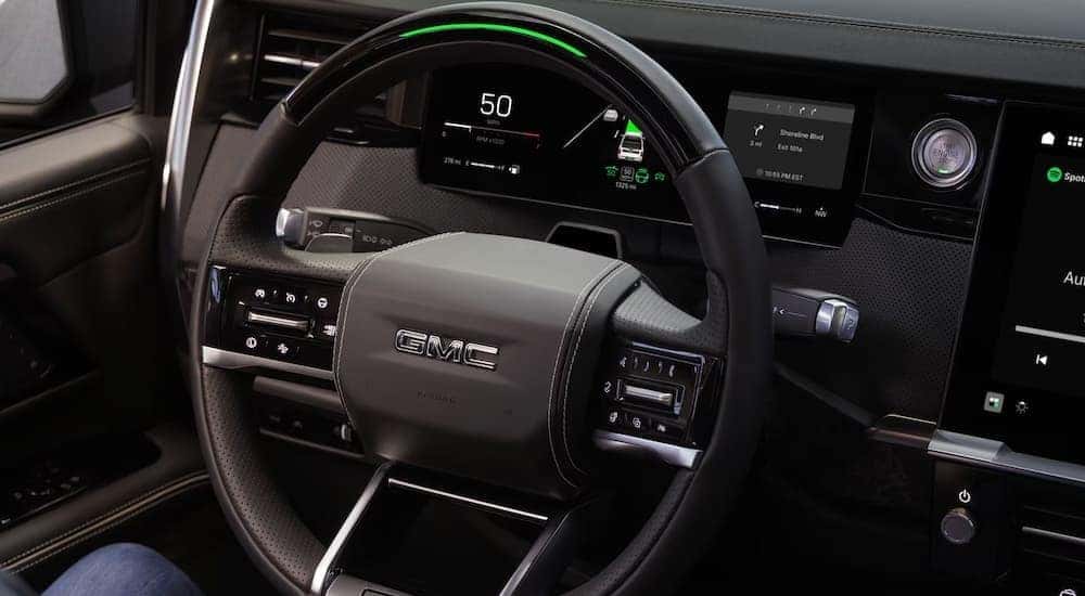The steering wheel in a 2027 GMC Sierra 1500.