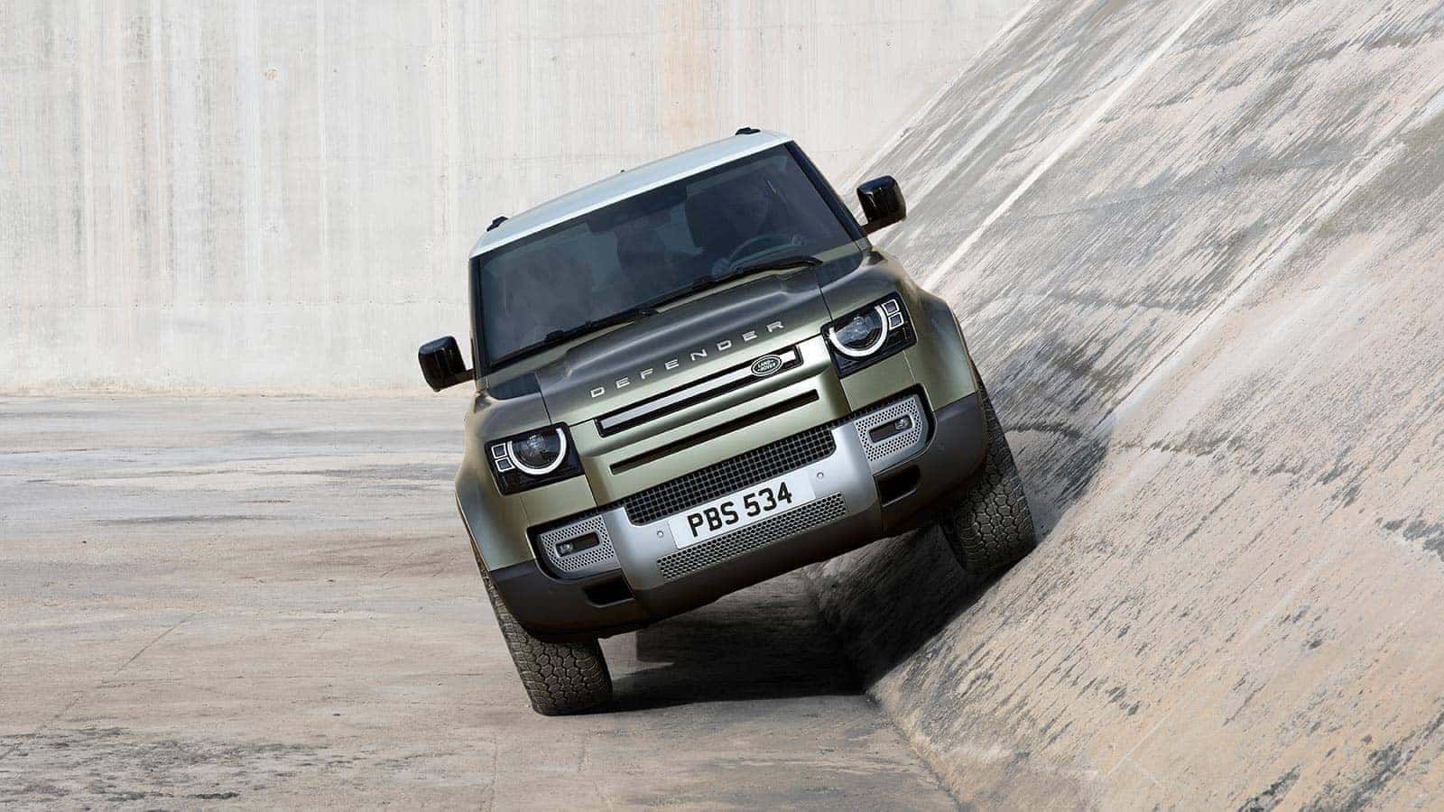 Defender drives on angled concrete wall