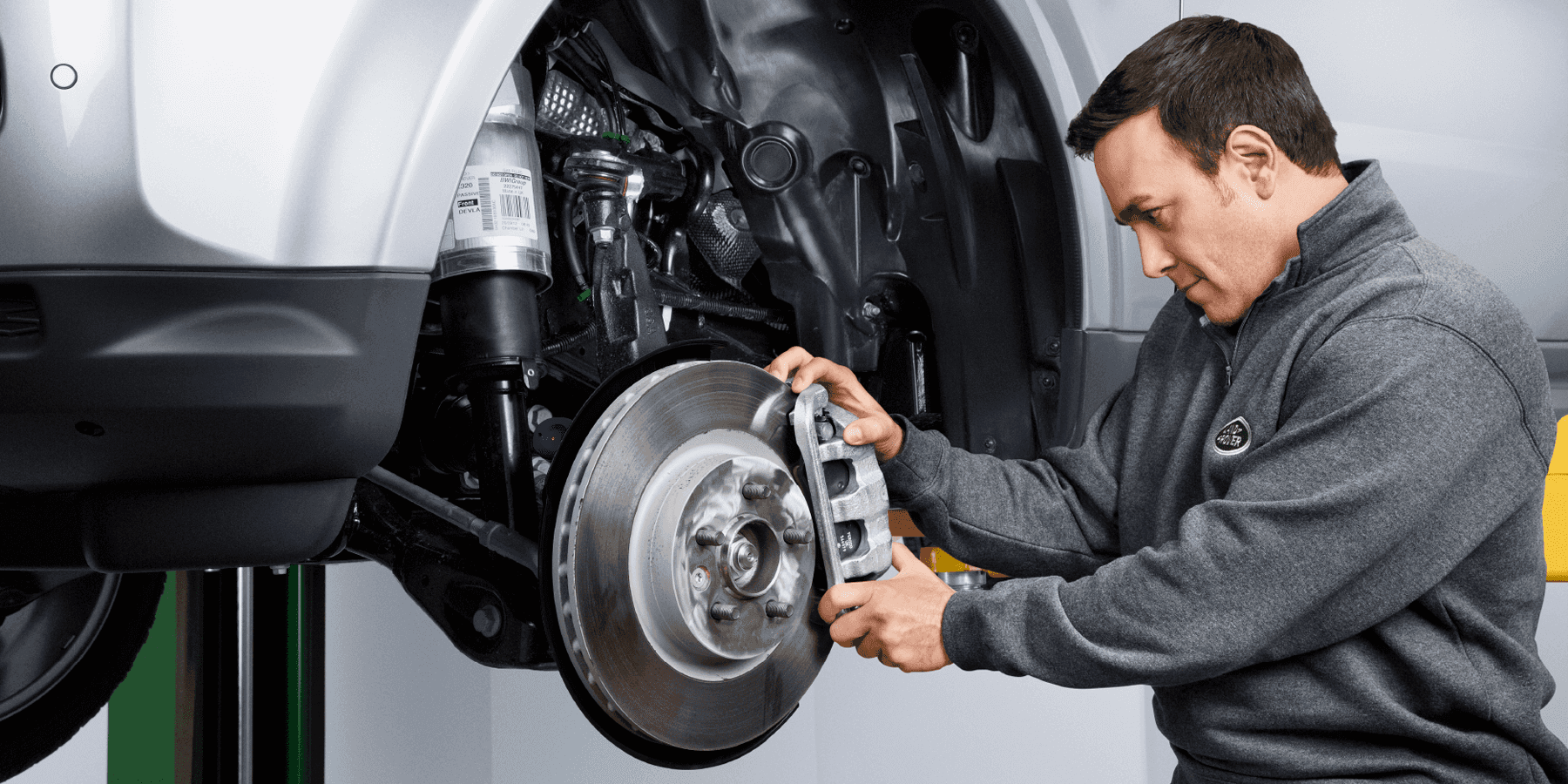 Land Rover Technician replacing brakes