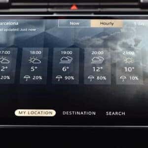 Range Rover Sport weather forecast display showing hourly Barcelona weather with temperature and precipitation probability
