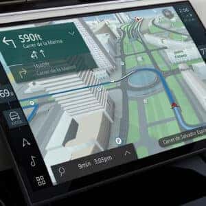 Range Rover Sport navigation display showing 3D map view with turn directions in Barcelona