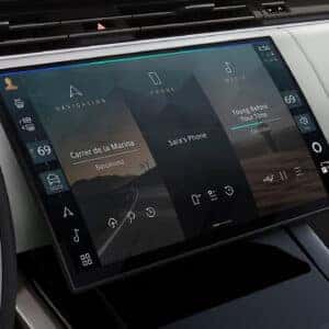 Range Rover Sport infotainment display showing navigation, phone, and media options in a three-panel interface