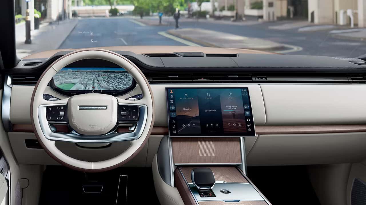 driver's view of a 2025 range rover with cream interior