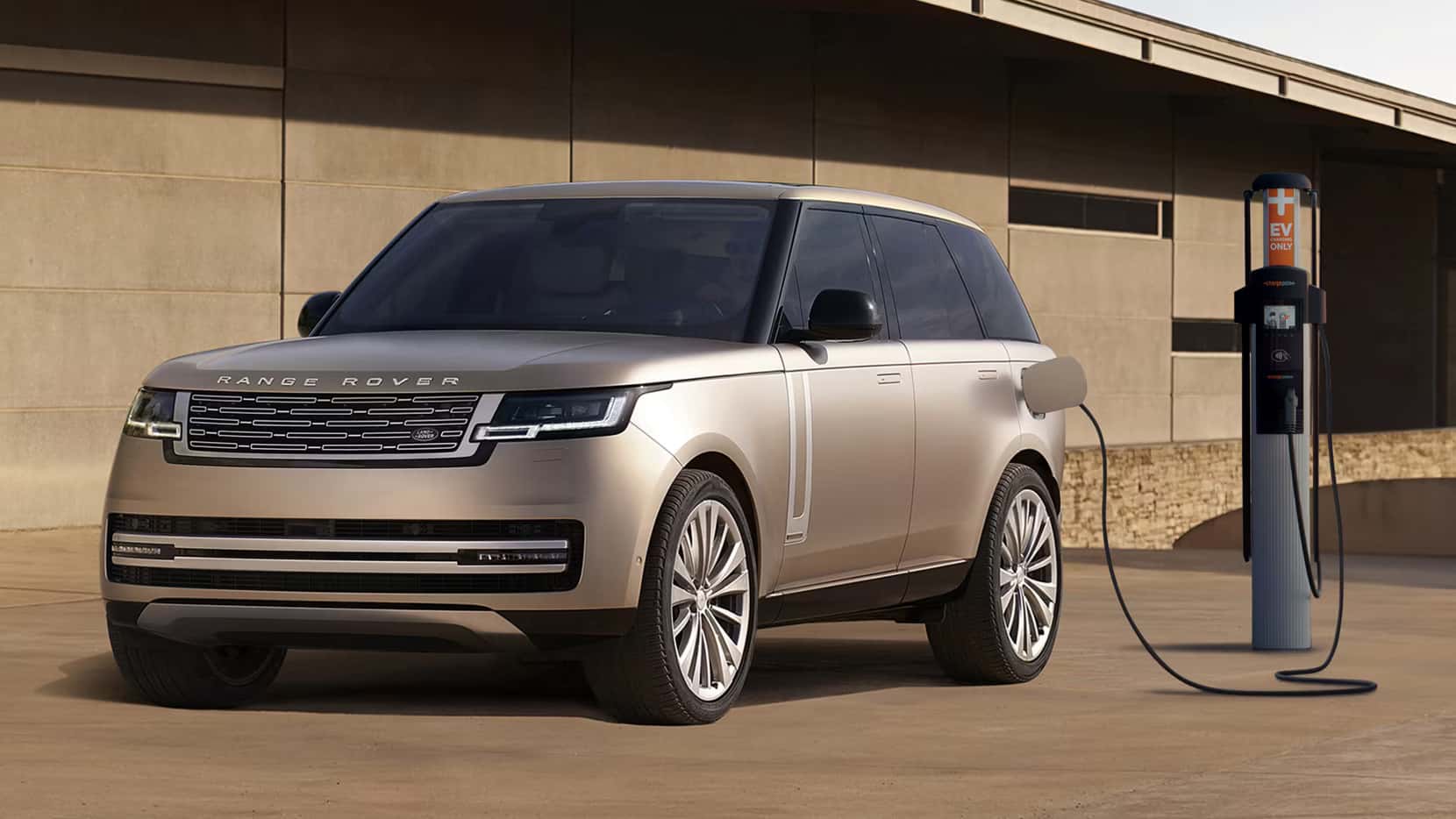 a range rover parked and charging at an EV charging station