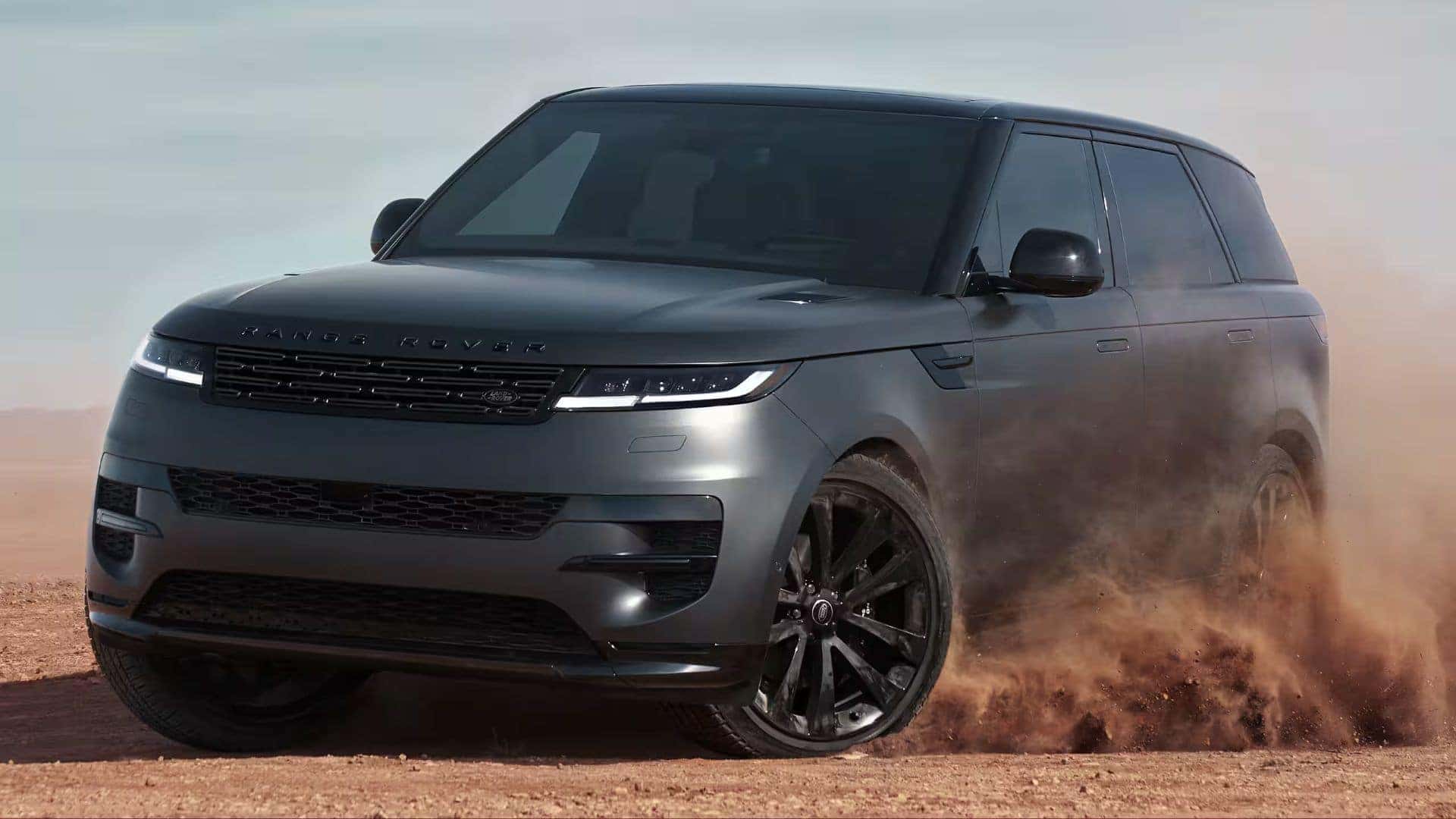 a 2026 range rover sport driving in sand