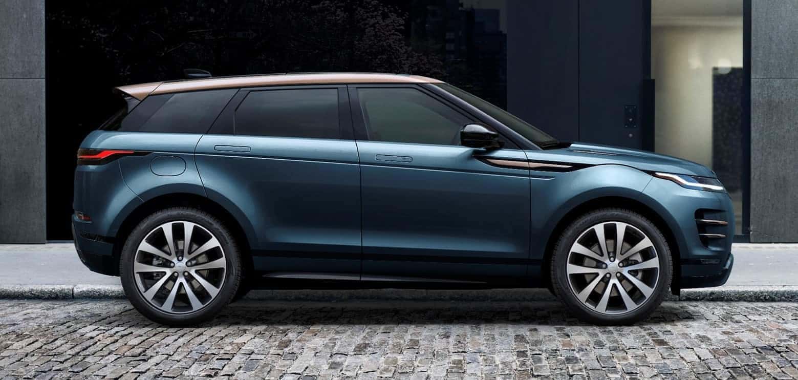 2026 range rover evoque side profile parked next to a curb in the city