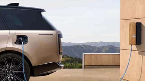 A 2026 Discovery plugged in to a charging station