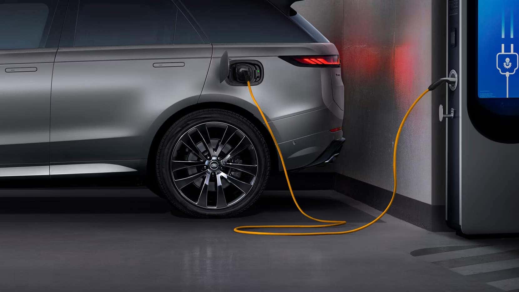 a 2026 Ranger Rover Sport PHEV pluged into a charger