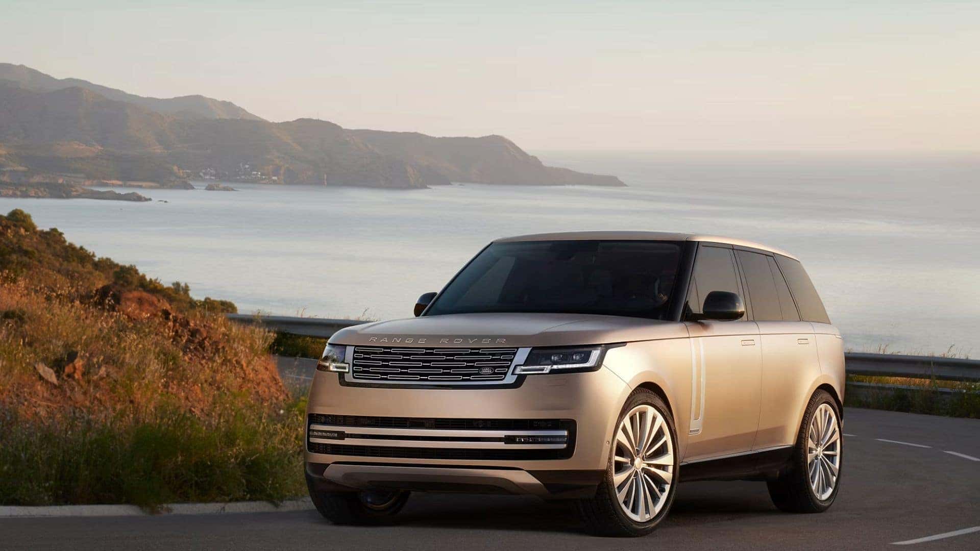 2026 Range Rover driving up a road